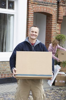 Movers handling flat removals in Chiswick on a residential street