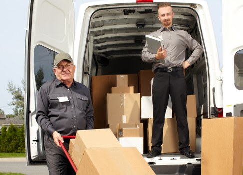 Packed moving boxes and furniture prepared for a Chiswick removal