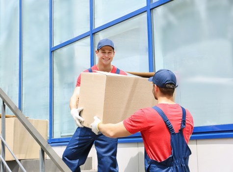 Professional Chiswick man and van loading furniture into a delivery van