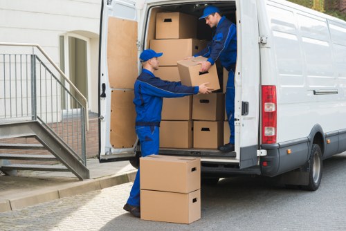 Staff assessing moving hazards before lifting items