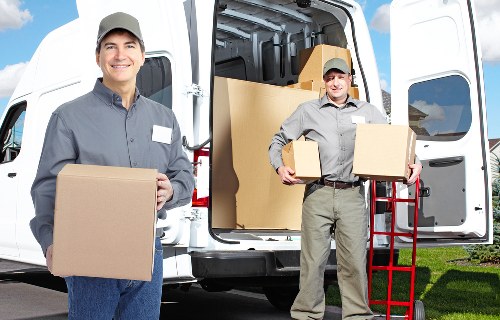 Van and driver loading furniture for a collection in Chiswick