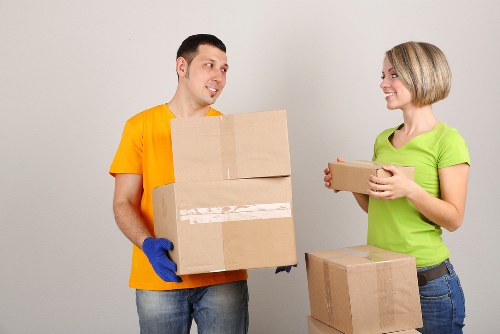 Furniture removal team handling bulky items in a Chiswick property